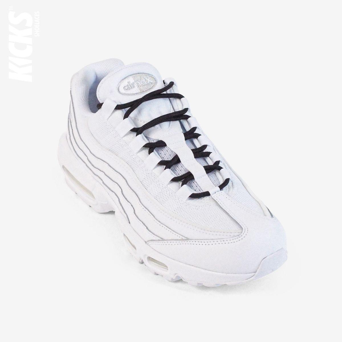 Black round shoestrings on white sneakers by Kicks Shoelaces