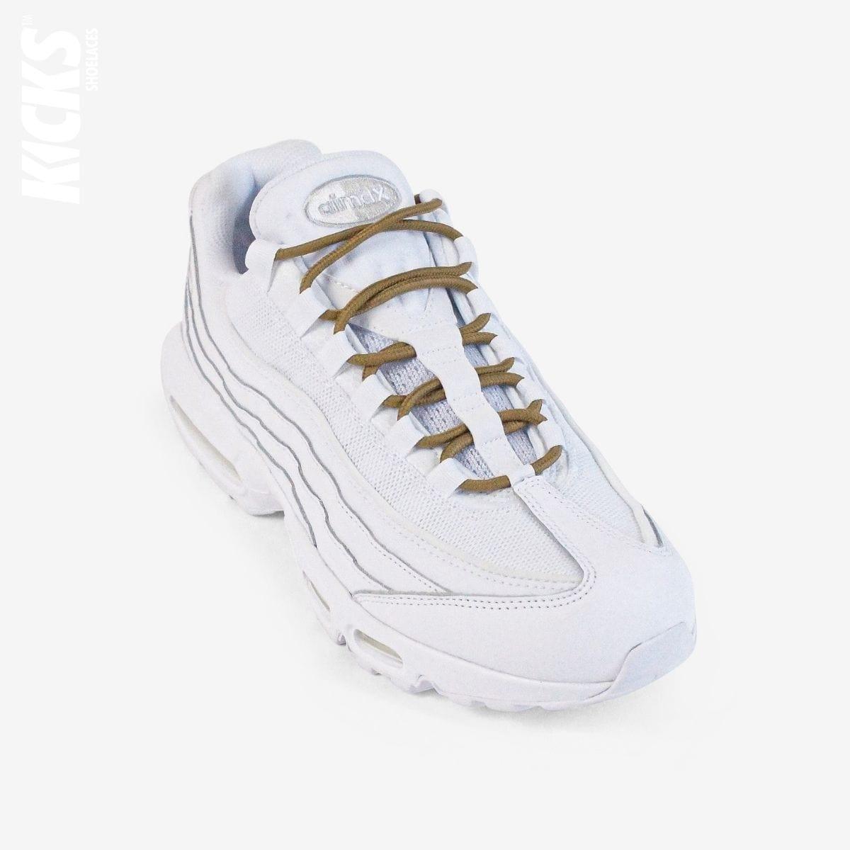 Light brown round shoestrings on white sneakers by Kicks Shoelaces