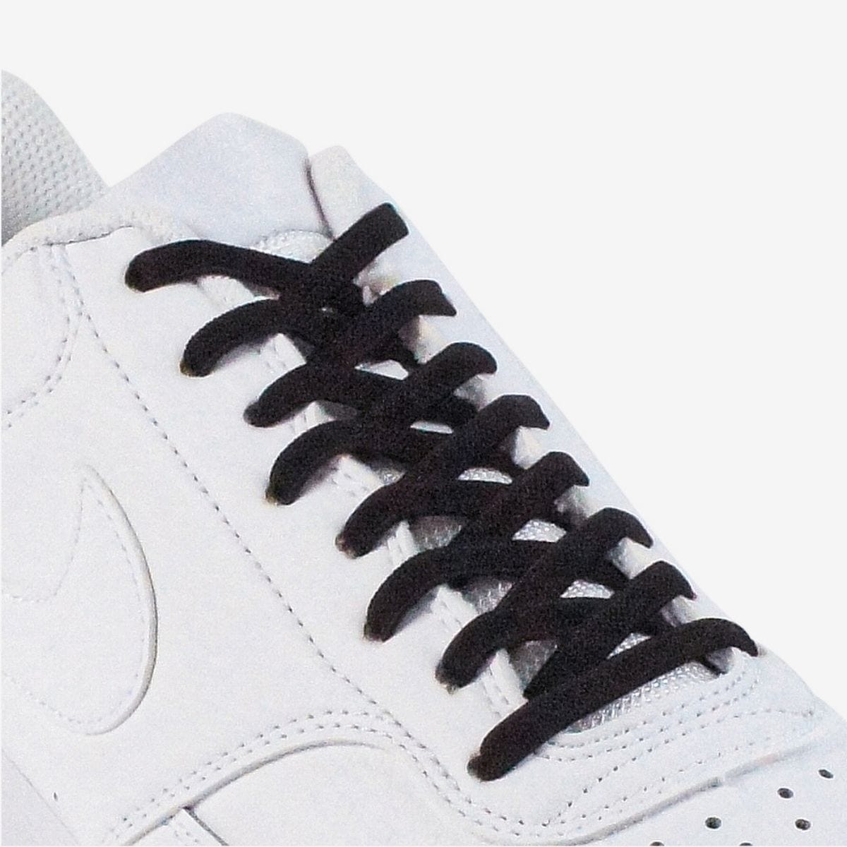 kids-no-tie-shoelaces-with-black-laces-on-nike-white-sneakers-by-kicks-shoelaces