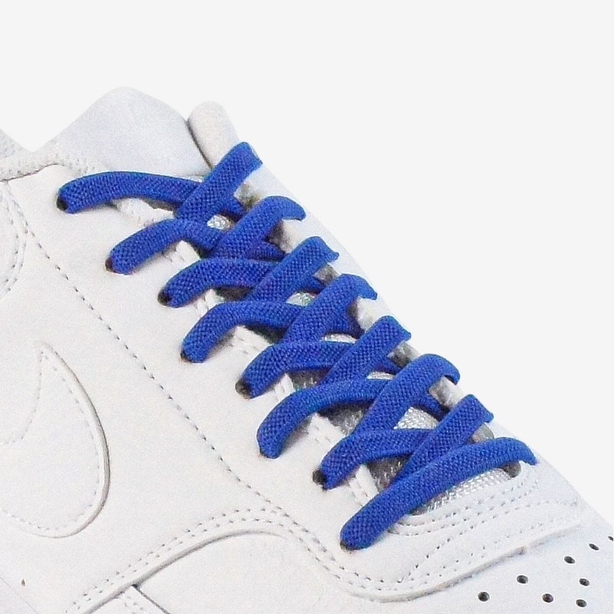 kids-no-tie-shoelaces-with-royal-blue-laces-on-nike-white-sneakers-by-kicks-shoelaces