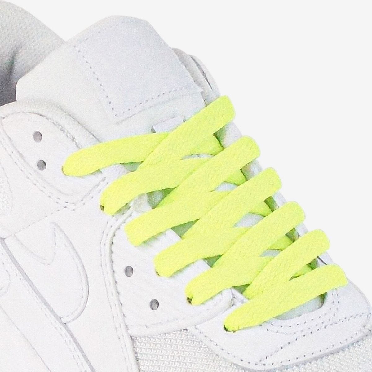 shoelace-patterns-on-womens-sneaker-using-fluorescent-green-laces